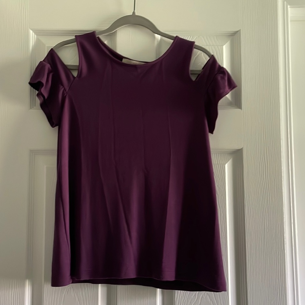 Purple shirt. Cute with white skirt or shorts.